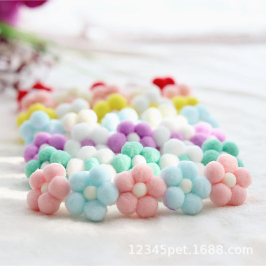 Pastel-colored flower-shaped beads on a white background