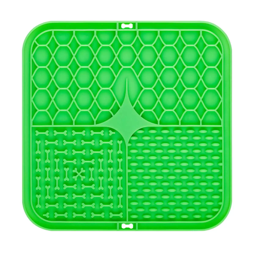 Green silicone mat with textured design on a white background