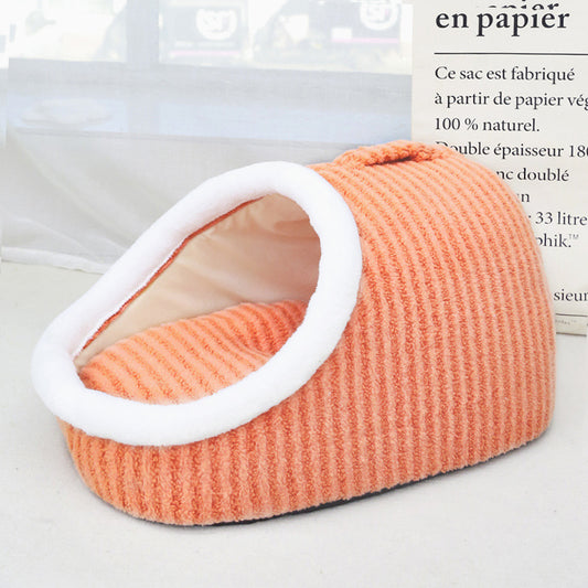 Orange pet bed with white interior on a light background