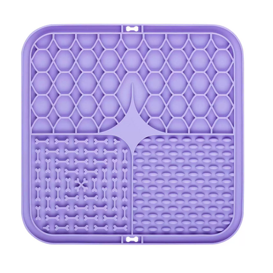Purple silicone mat with textured surface on a white background