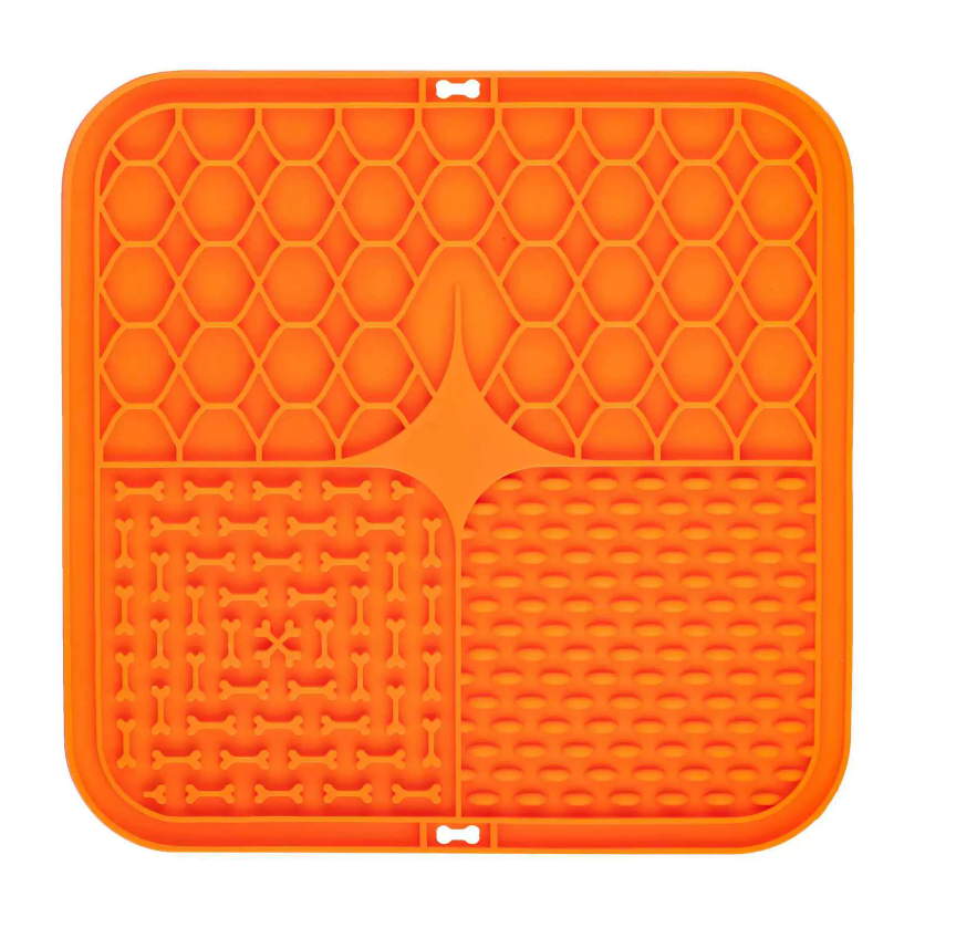 Orange silicone mat with textured design on a white background